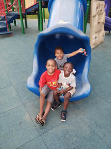 Children on Playground Slide